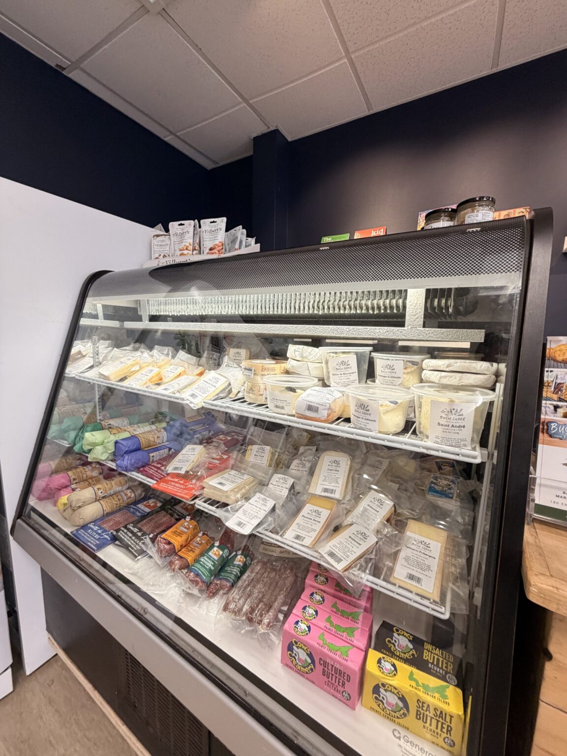 The Pantry cheese case stocked with Canadian, British and European cheeses and cured meats