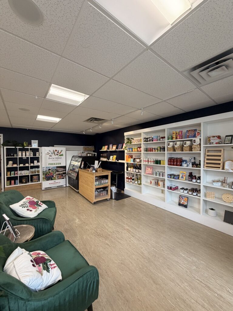 The Pantry seating area with shelves of food and drink inside Yellowknife Books
